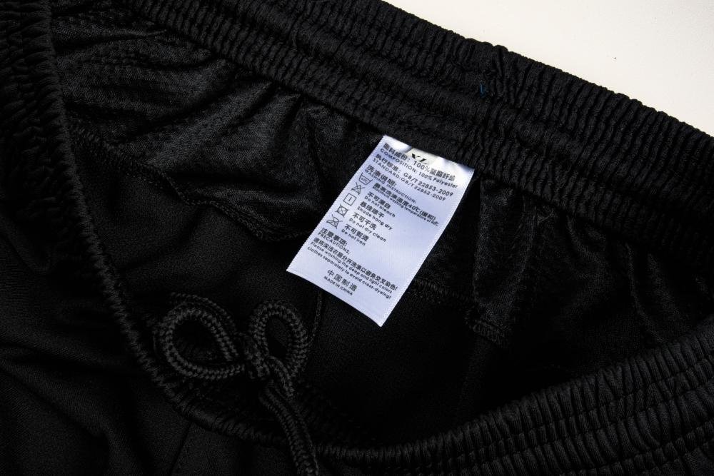 Close-up factory photo of pro-grade 150gsm pinhole mesh soccer uniform set by professional wholesale soccer jerseys