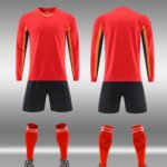 Close-up factory photo of sublimated Red soccer uniform set by professional wholesale custom soccer jerseys