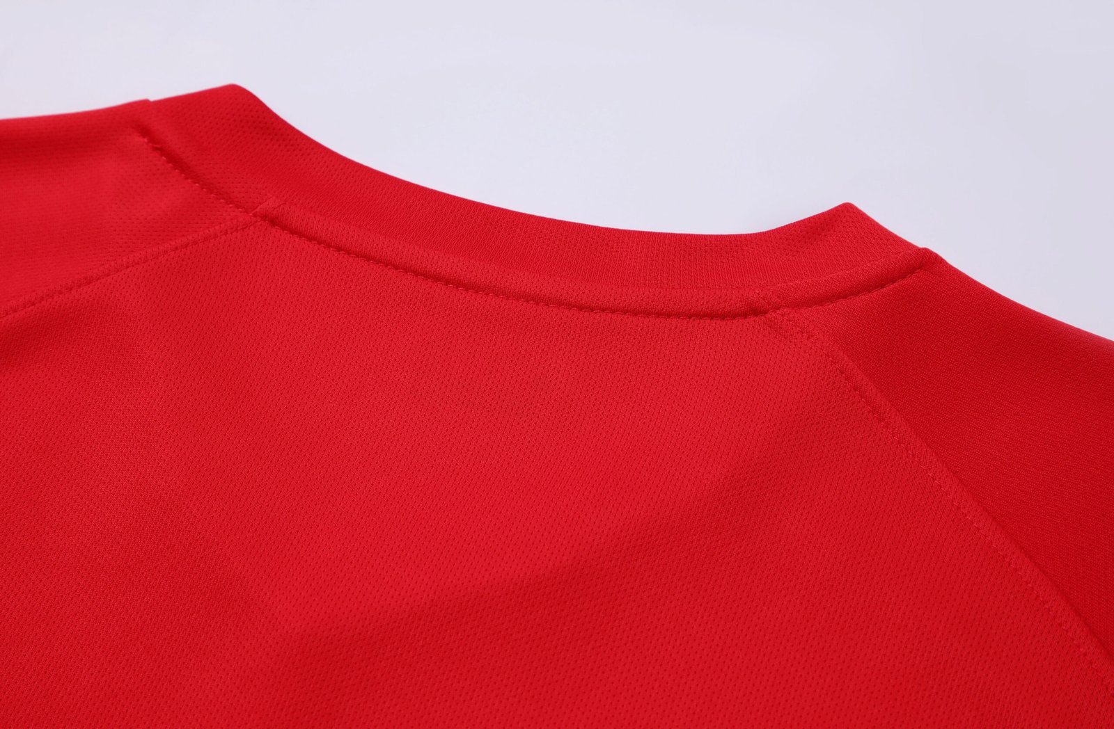 Close-up factory photo of sublimated Red soccer uniform set by professional wholesale custom soccer jerseys (6)