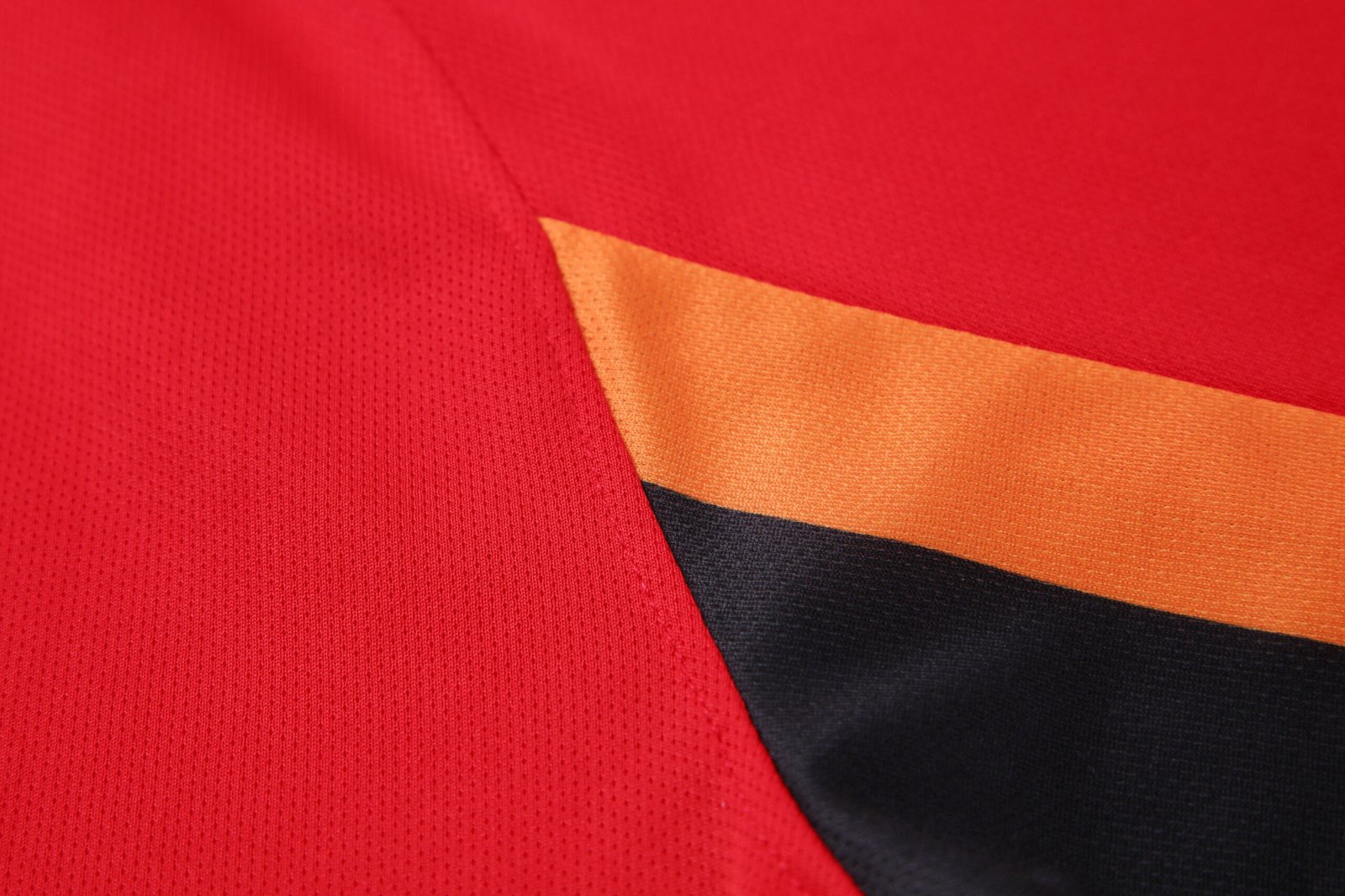 Close-up factory photo of sublimated Red soccer uniform set by professional wholesale custom soccer jerseys (8)