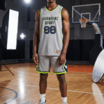 Athletic man modeling grey neon green reversible basketball uniform with private logo and number