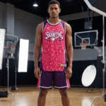 Athletic man in pink and navy basketball uniform with Shanying 6 holding basketball