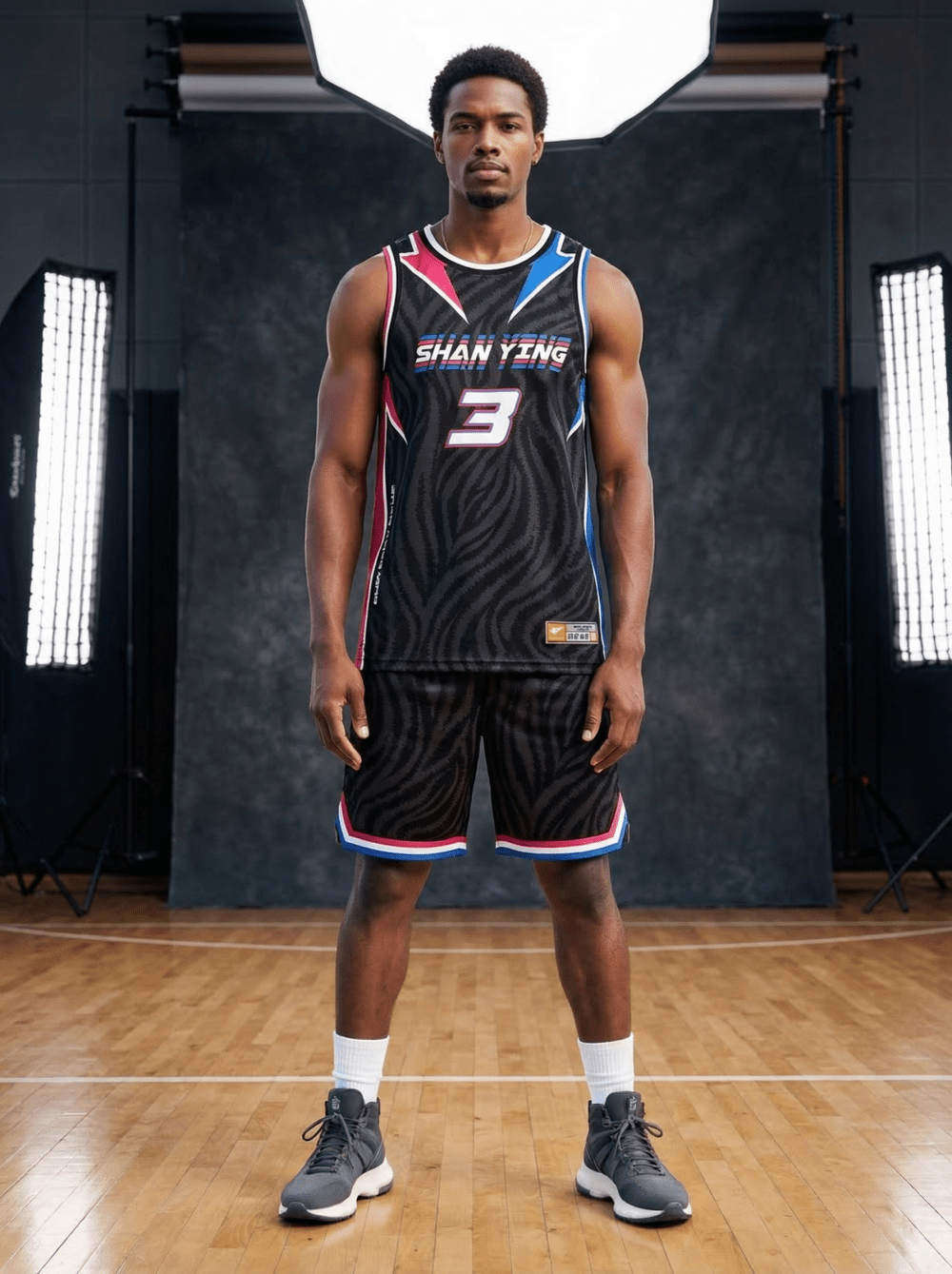 Man wearing black zebra pattern reversible basketball jersey with Shanying 3