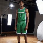 Man wearing green custom basketball jersey with number 1