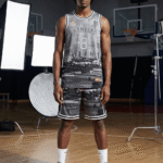 Man wearing grey black and white cityscape Shanying 8 basketball uniform