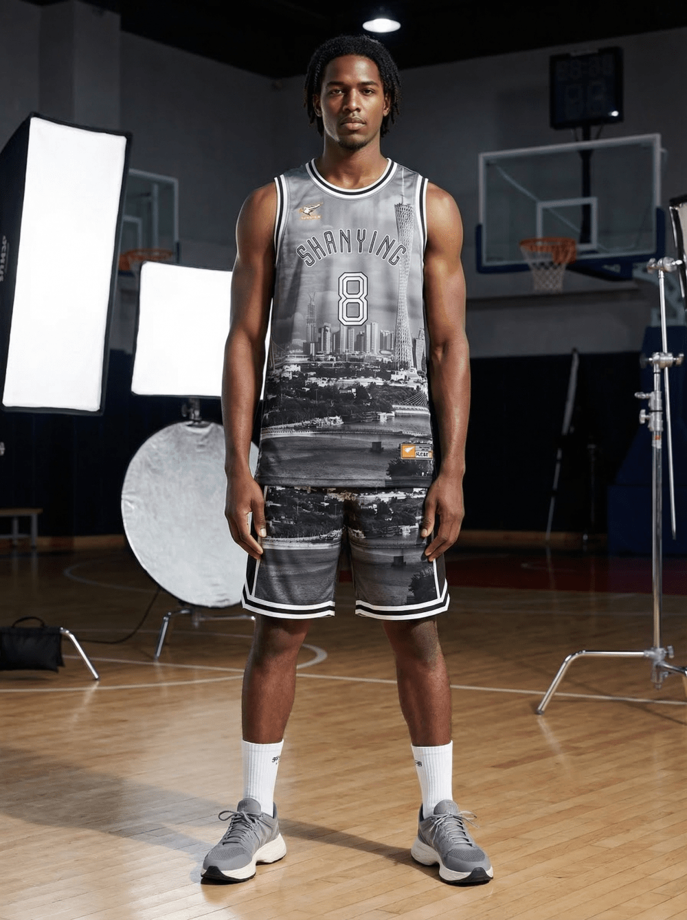 Man wearing grey black and white cityscape Shanying 8 basketball uniform