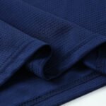 Close-up-premium-grade-ribbed-crew-neck-set-in-sleeves-black-soccer-factory-photo