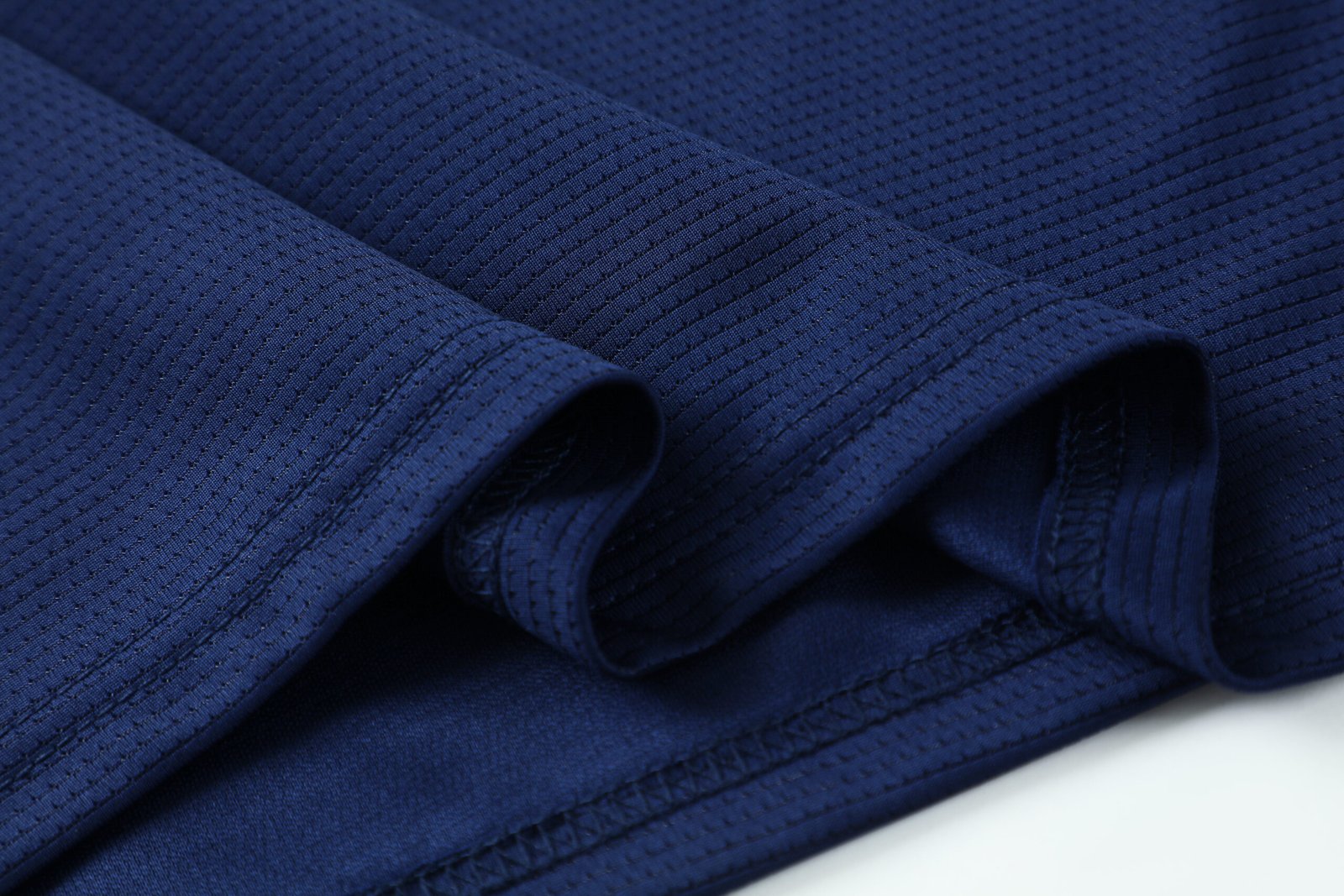 Close-up-premium-grade-ribbed-crew-neck-set-in-sleeves-black-soccer-factory-photo