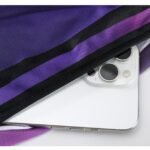 Purple and black basketball uniform fabric with phone pocket size demonstration