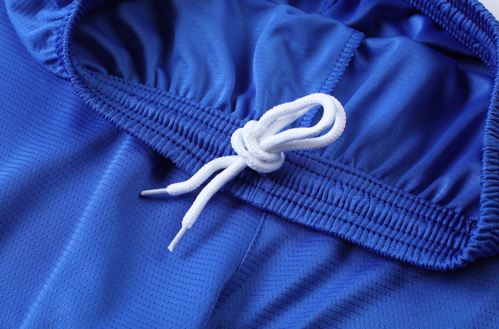 Sublimated Blue soccer shorts photo with overlapping v-neck and raglan sleeves for soccer jersey manufacturer.