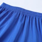 Sublimated soccer shorts photo with overlapping v-neck and raglan sleeves for wholesale soccer jerseys.