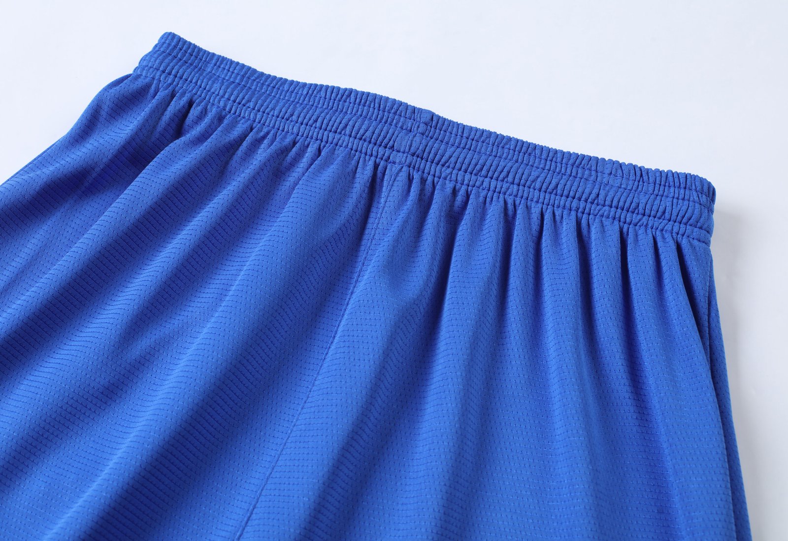 Sublimated soccer shorts photo with overlapping v-neck and raglan sleeves for wholesale soccer jerseys.