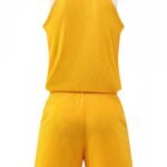 Back view of yellow basketball uniform with white accents
