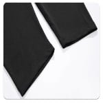 Close-up of black compression pants bottom hem with reinforced stitching
