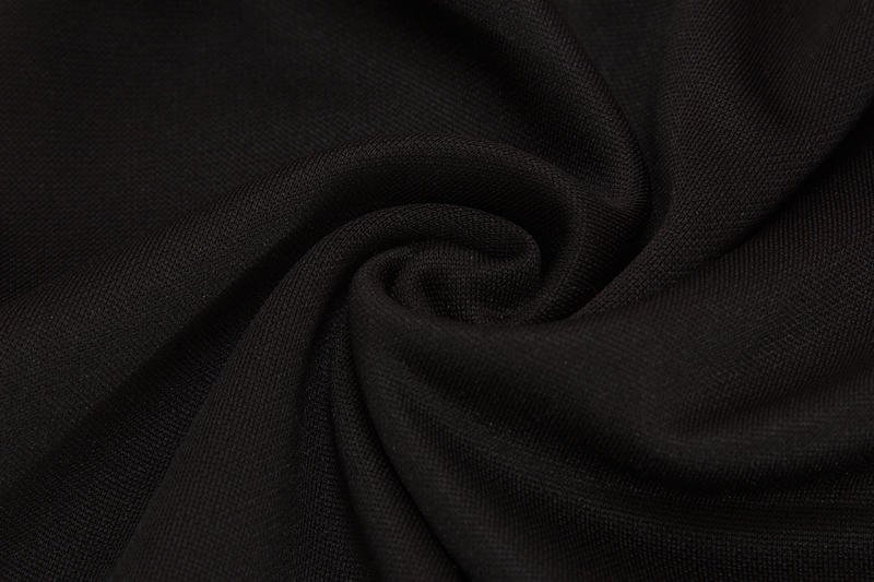 Close-up of soft black fabric texture for jogger sports pants