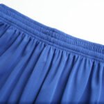 Elastic waistband close-up of blue mesh soccer shorts