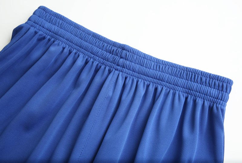 Elastic waistband close-up of blue mesh soccer shorts