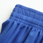 Blue soccer shorts elastic waistband and fabric texture detail