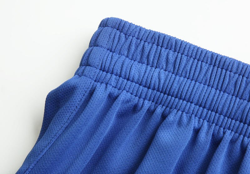 Blue soccer shorts elastic waistband and fabric texture detail