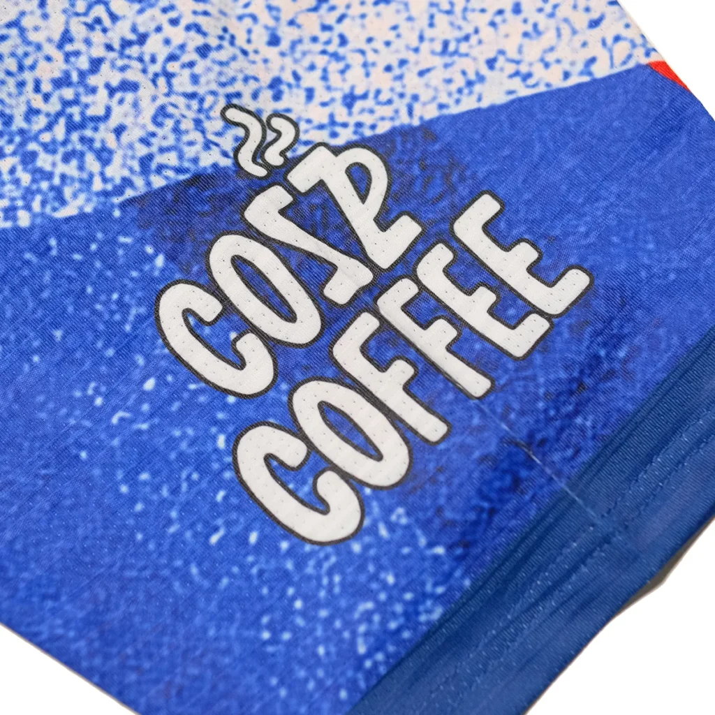 Cozz Coffee text print detail on blue sublimation jersey sleeve