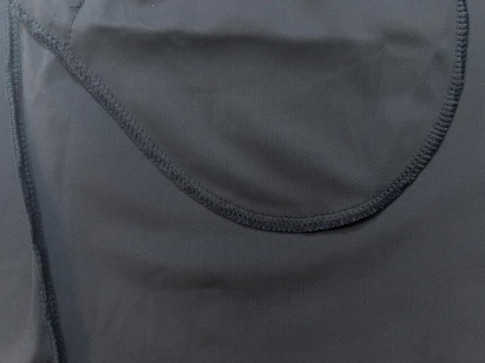 Close-up of the inner compression liner in custom sport shorts, featuring overlock stitching for durability and comfort in bulk wholesale orders.