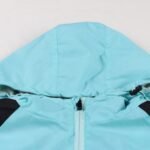 Hood and collar close-up of light blue soccer windbreaker