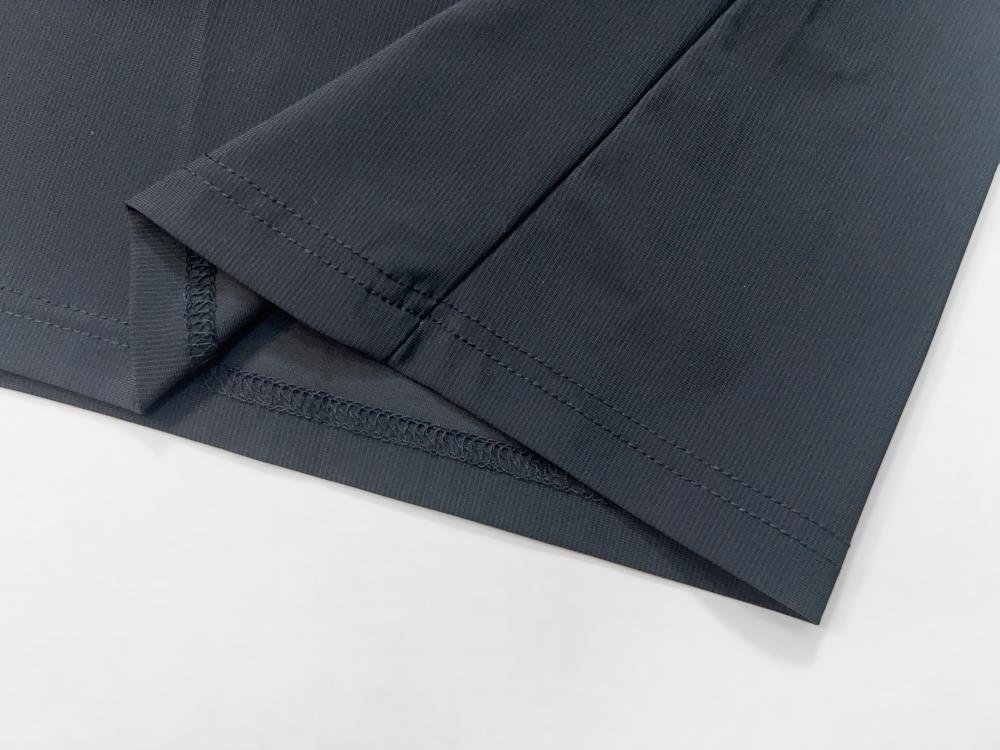 Detailed hem finish of a compression liner inside custom running shorts, highlighting the clean stitching and quality control for private label sportswear.