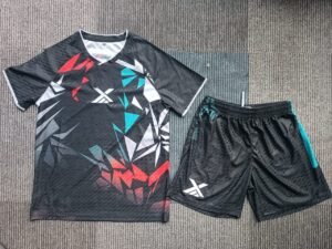 holesale custom sublimated soccer training suit front view, featuring black jacquard fabric V-neck jersey and shorts for small batch OEM manufacturing.