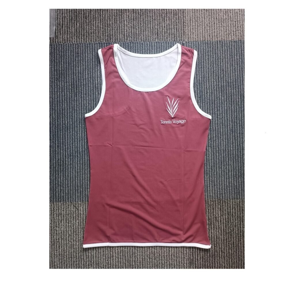 Front view of maroon custom women's tennis tank top made with 190GSM milk silk spandex fabric.